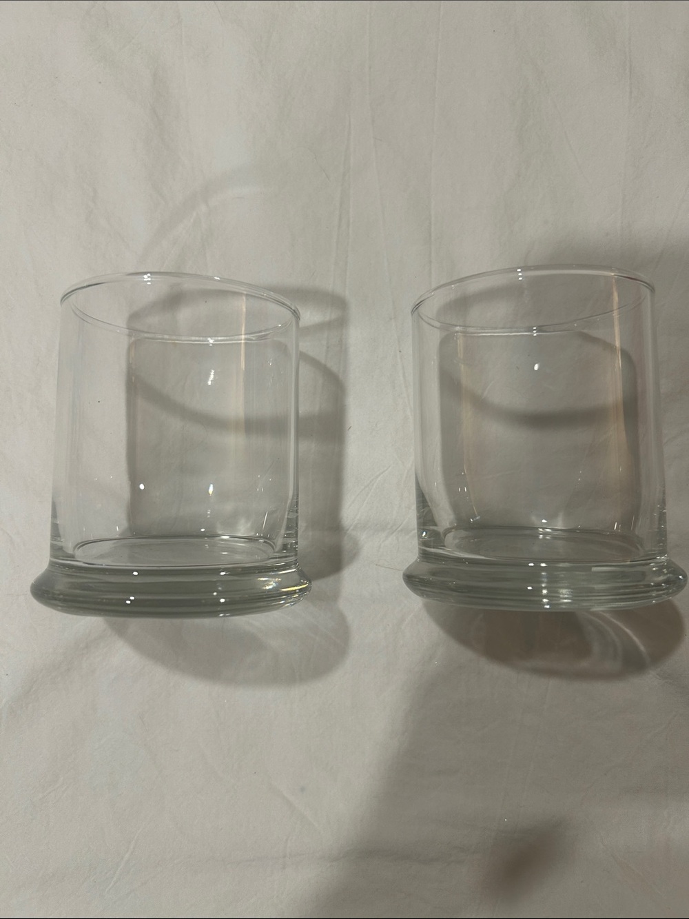 2 glass candle votives.